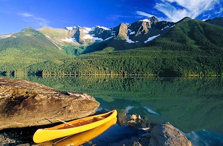 Scenic mountains, lake and canoe
